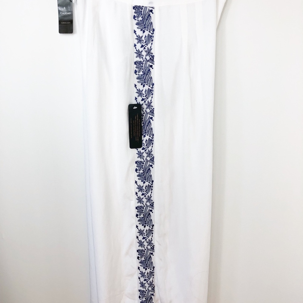 Bebe white wide leg‎ culottes embroidered blue band